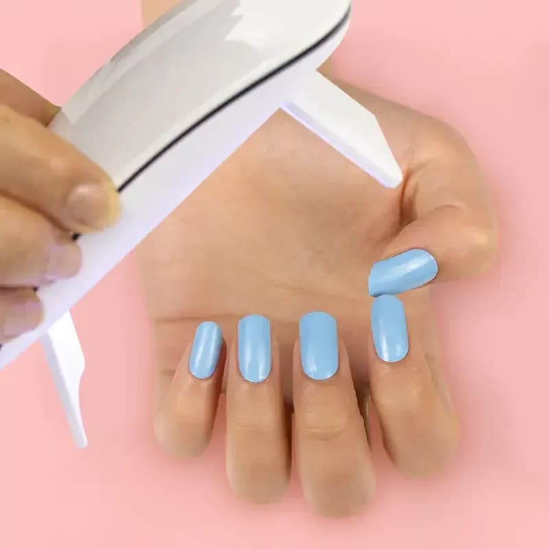 Curing Cloud Nine gel nail strips under an LED UV lamp