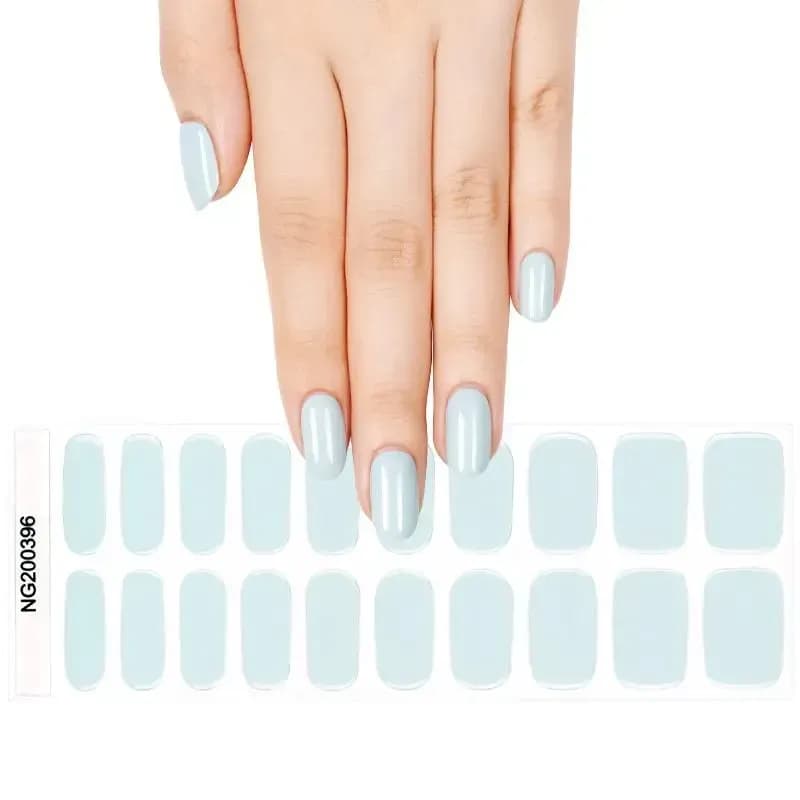 Coastal Breeze pale blue gel nail strips, the full 20-strip sheet under a manicured hand