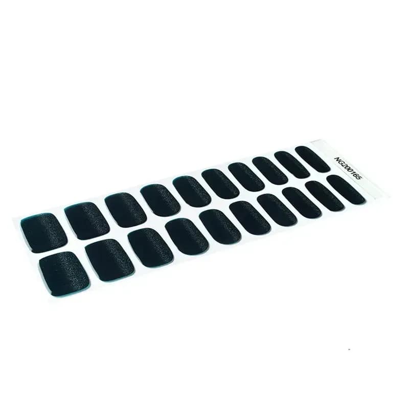 Emerald Twinkle dark green glitter gel nail strip sheet, angled view