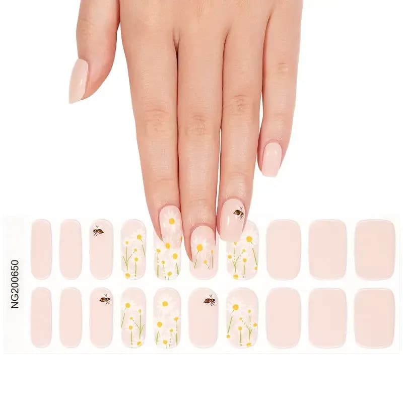 Honey Bee gel nail strips, the full 20-strip sheet with daisy and bee designs under a hand