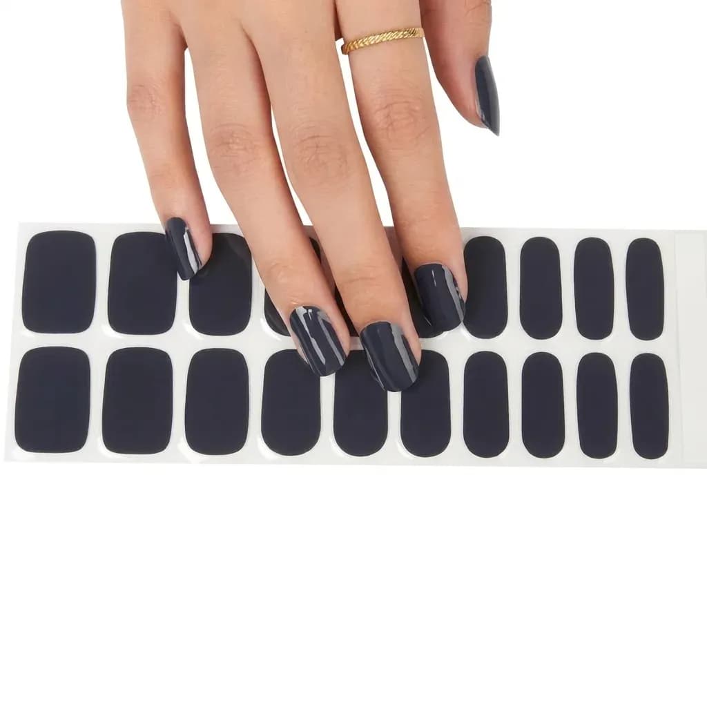 Midnight Navy gel nail strips, the full 20-strip sheet under a manicured hand