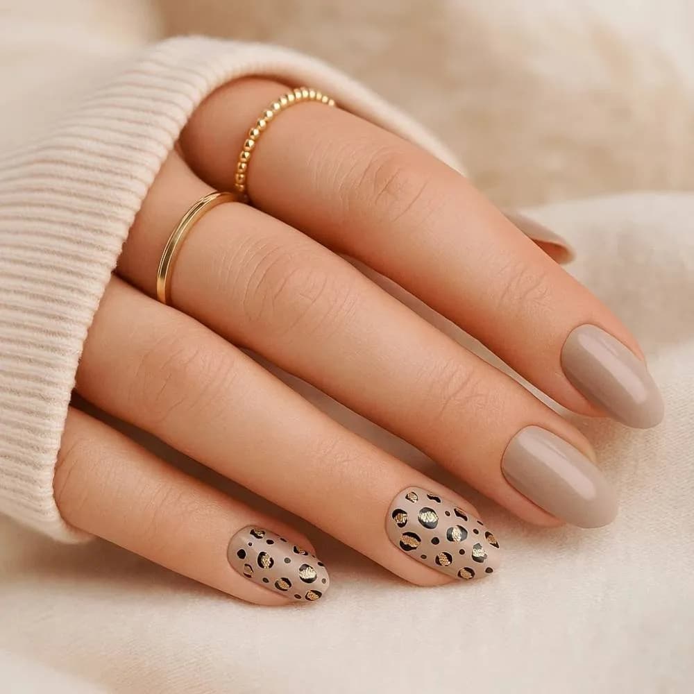 Nude Safari taupe semi-cured gel nail strips with leopard print accents, close up on real nails