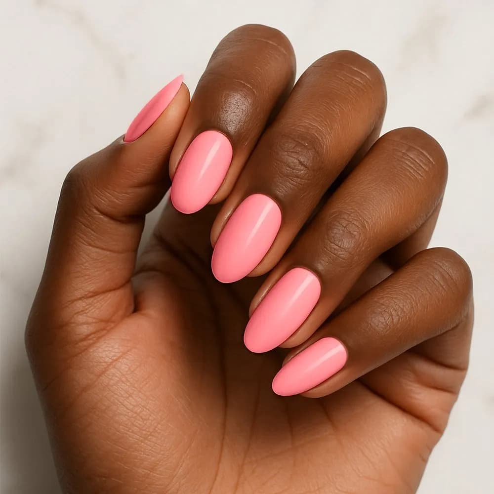 Pretty in Pink coral pink semi-cured gel nail strips, close up on real nails