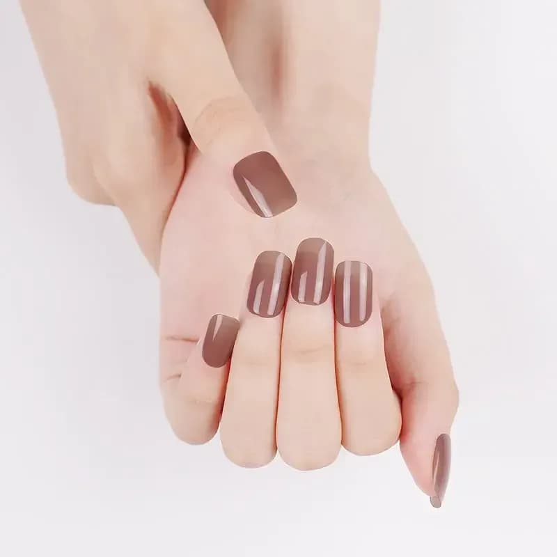 Sweet Caramel warm brown gel nails shown on softly crossed hands