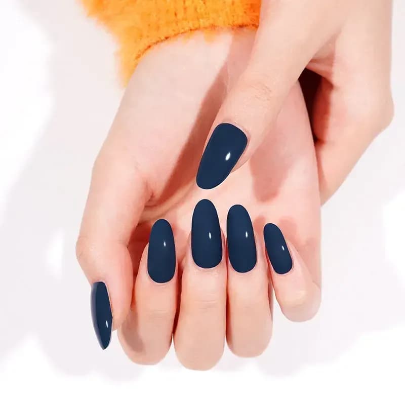 Teal of Approval deep teal gel nails shown on resting hands