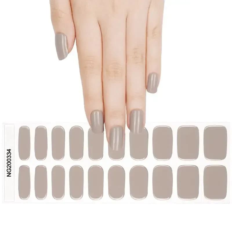 Timeless Taupe greige gel nail strips, the full 20-strip sheet under a manicured hand