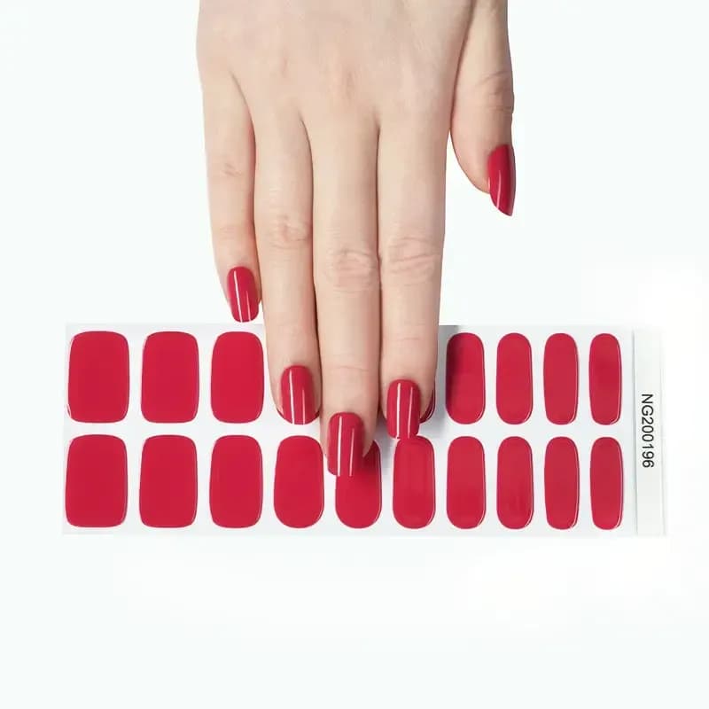 Wild Orchid raspberry pink gel nail strips, the full 20-strip sheet under a manicured hand