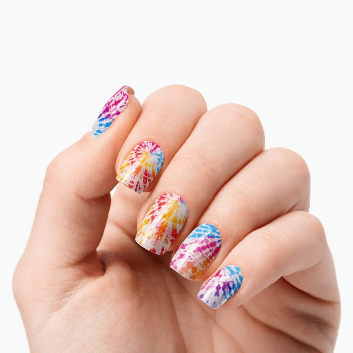Velvora Tie-Dye semi-cured gel nail strips on a hand with colourful summer swirl nails
