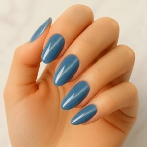 Velvora Electric Blue semi-cured gel nail strips in vibrant blue with subtle shimmer on almond-shaped nails, product photo for UK customers