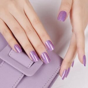 Two hands with Holographic Amethyst gel strips resting on a lilac purse, rainbow holographic purple nails.