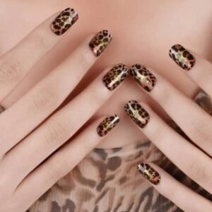 Lifestyle shot: Velvora leopard gel nail wraps paired with matching leopard outfit – fierce fashion statement