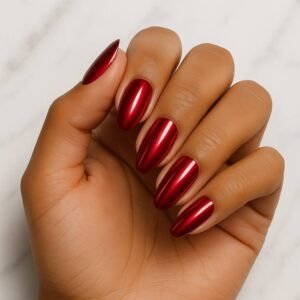 Velvora Molten Ruby semi-cured gel nail strips in mirror-shine metallic red on almond-shaped nails, product photo for UK customers.