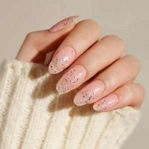 Close-up of Velvora Royal Dip nails: blush-pink base fading into silver glitter.