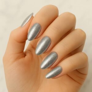 Velvora Silver Glam semi-cured gel nail strips in metallic silver micro-glitter on almond-shaped nails, product photo for UK customers