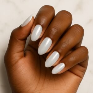 Velvora Snow Pearl semi-cured gel nail strips in pearlescent snowy white on almond-shaped nails, product photo for UK customers.
