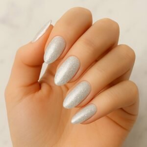 Velvora Stardust semi-cured gel nail strips with silver glitter on almond-shaped nails, product photo for UK customers