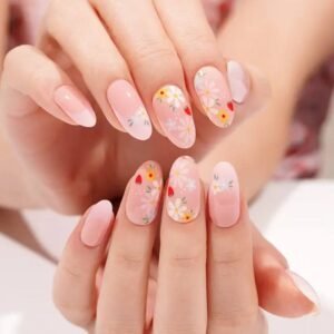 Both hands with Velvora Strawberry Fields floral strawberry nail wraps.