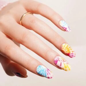Close-up of Velvora Tie-Dye nails: rainbow tie-dye bursts on a milky-white base.