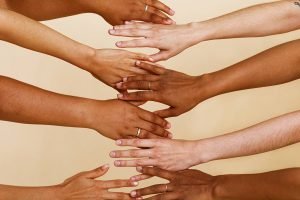 Hands with different skin tones showing how to choose gel nail strip colours – Velvora UK