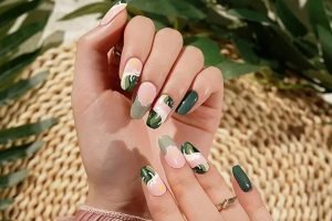 Close-up of trendy green and pink gel nail strips design, perfect for UK beauty lovers in 2025