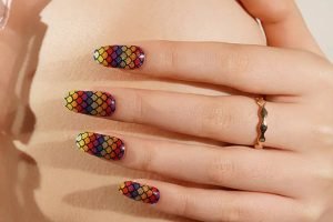 Close-up of long-lasting rainbow glitter gel nail strips with a mermaid scale design, perfect for extended wear